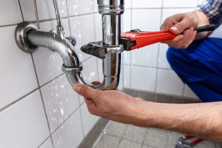 plumber checking pipes